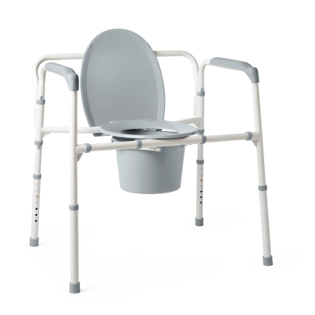 The Medline Bariatric Folding Commode features a light gray seat, adjustable height legs, and armrests. Its heavy-duty steel frame offers durability with a removable bucket beneath the primarily white structure. It boasts an extra-wide 24 seat and supports up to 650 lb capacity.